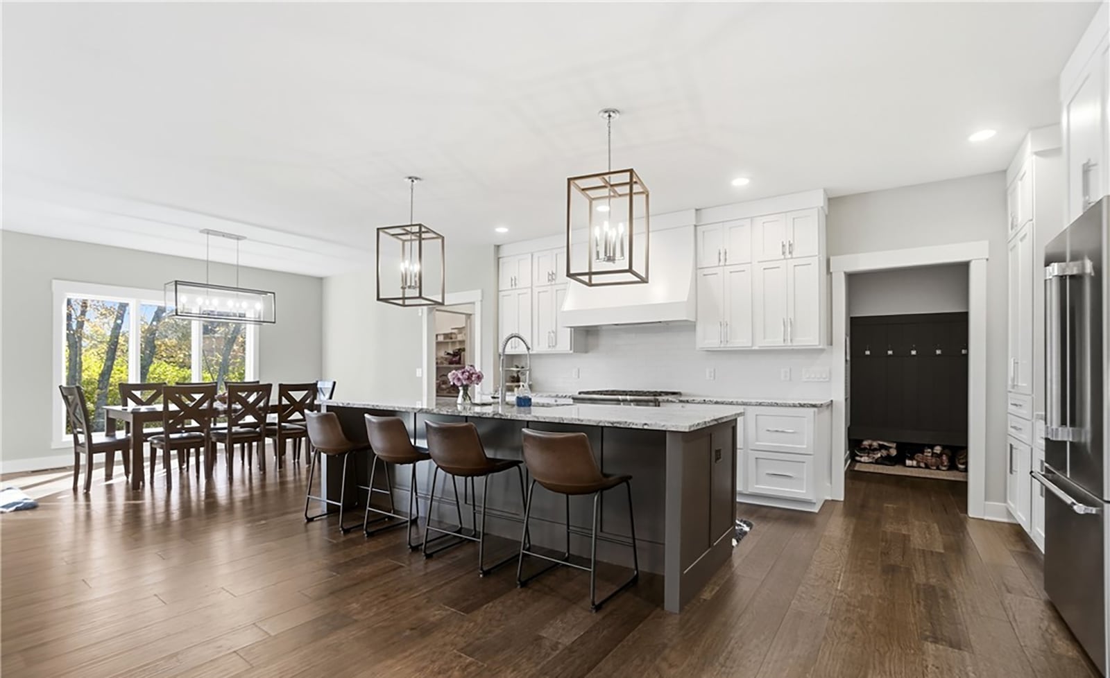 The kitchen has custom built cabinets, hardwood floors, high end stainless appliances and an island with bar seating. CONTRIBUTED