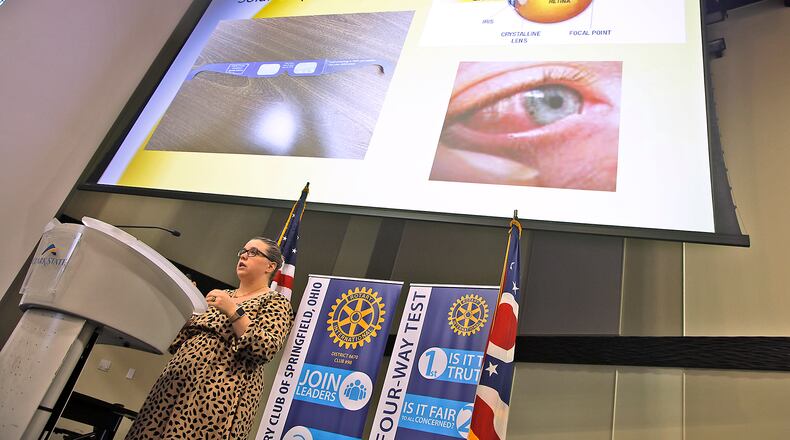 Stephanie Johnson, from the Clark County Combined Health District, talks to members of the Springfield Rotary Club about the upcoming solar eclipse and the importance of wearing Solar Eclipse Glasses to protect your eyes Monday, March 4, 2024. BILL LACKEY/STAFF