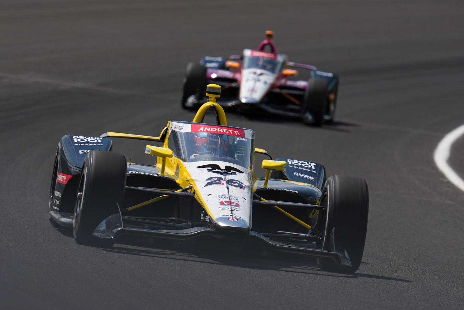 Colton Herta drives through the first turn during practice for the Indianapolis 500 auto race at Indianapolis Motor Speedway in Indianapolis, Thursday, May 15, 2025. (AP Photo/Michael Conroy)