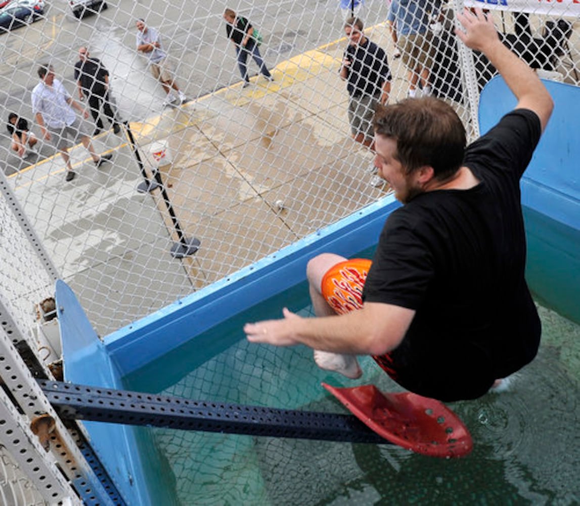 Sun columnist Andy McGinn sits in a dunking tank for charity