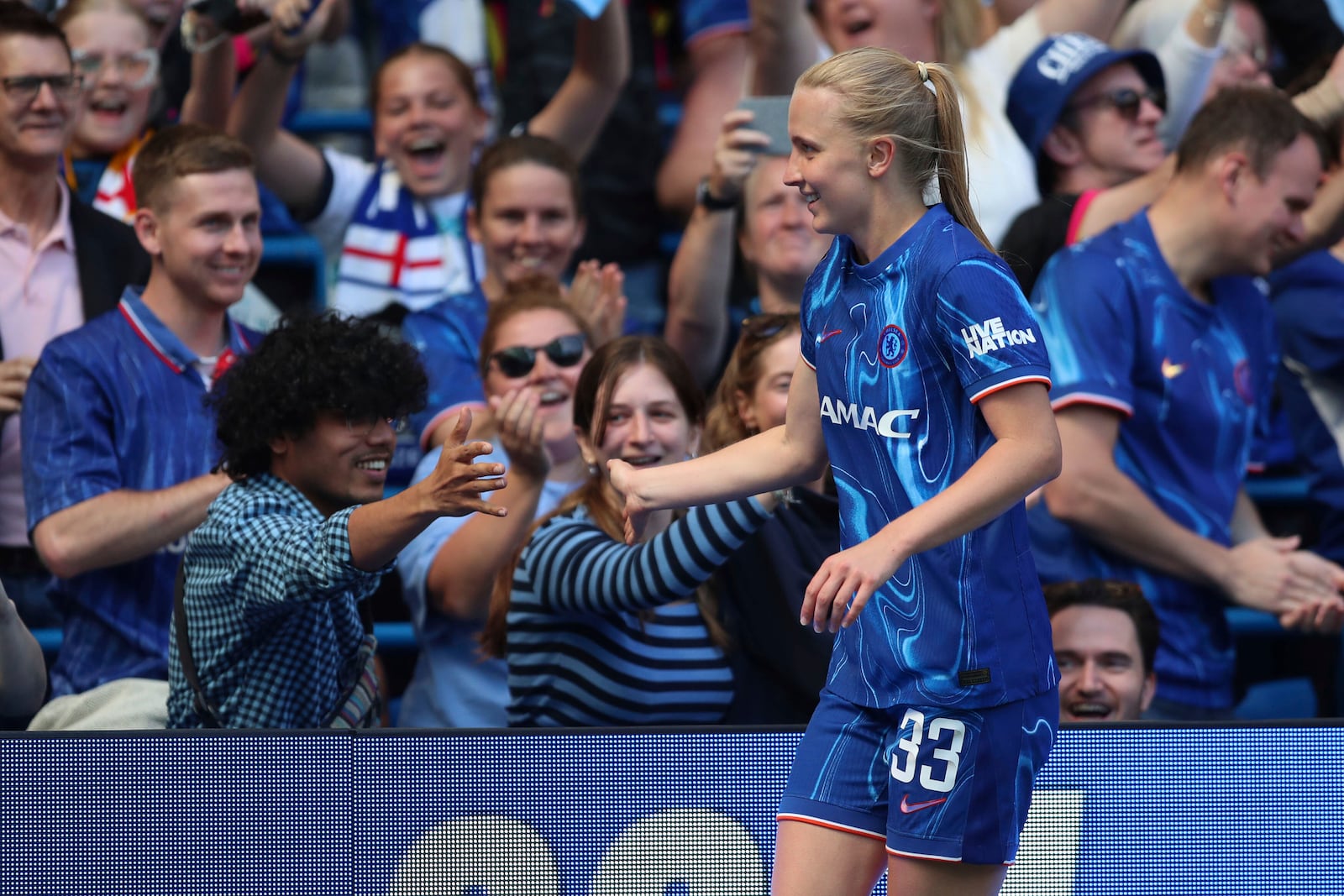 Chelsea's Aggie Beever-Jones celebrates scoring during the Women's Super League soccer match between Chelsea and Liverpool at Stamford Bridge, London, Saturday May 10, 2025. (Rhianna Chadwick/PA via AP)