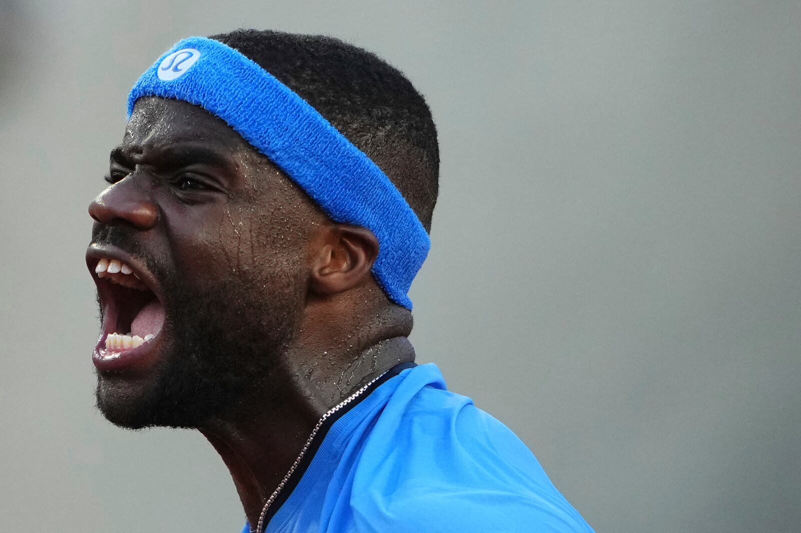 Frances Tiafoe of the U.S. reacts to winning a point against United States' Sebastian Korda during their third-round match of the French Tennis Open at the Roland-Garros stadium in Paris, Friday, May 30, 2025. (AP Photo/Lindsey Wasson)
