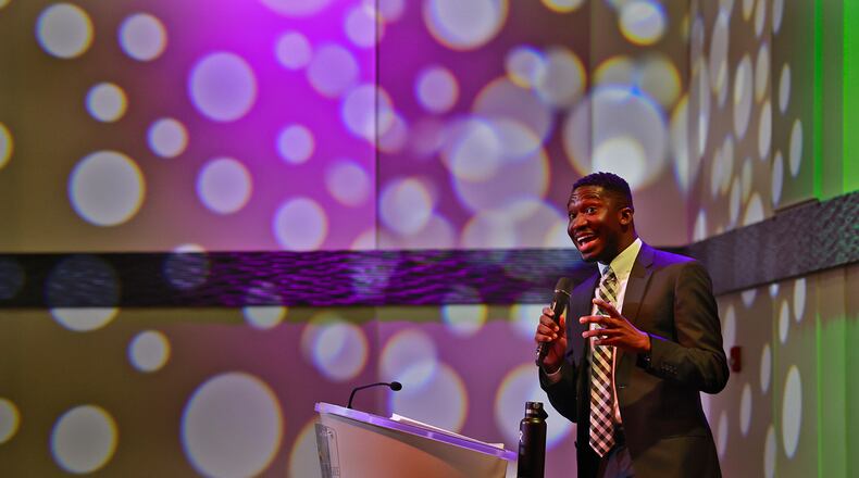 Joey Oteng, a Dean's Fellow of Inclusive Excellence at Ohio State University Moritz College of Law, gave the keynote address during the annual Martin Luther King Luncheon in the Hollenbeck Bayley Conference Center in Springfield, Friday, Jan. 13, 2023. BILL LACKEY/STAFF