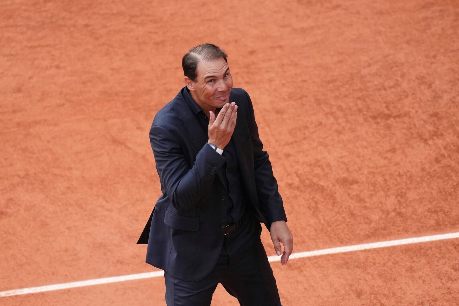 Rafa Nadal blows a kiss to fans during a farewell ceremony at center court Philippe-Chatrier, at the Roland-Garros stadium, in Paris, Sunday May 25, 2025. (AP Photo/Christophe Ena)
