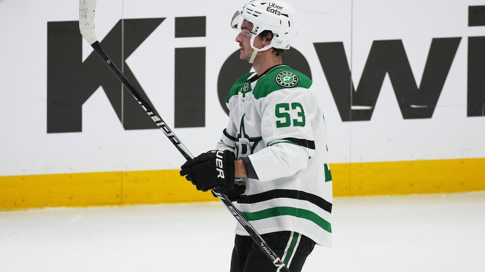 Dallas Stars center Wyatt Johnston reacts after scoring the winning goal during a shootout in an NHL hockey game against the Colorado Avalanche, Wednesday, March 18, 2026, in Denver. (AP Photo/David Zalubowski)