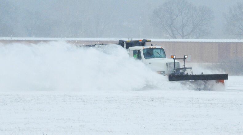 A city snow plow clears the runway at Middletown Regional Airport / Hook Field Monday, February 15, 2021 in Middletown. NICK GRAHAM / STAFF