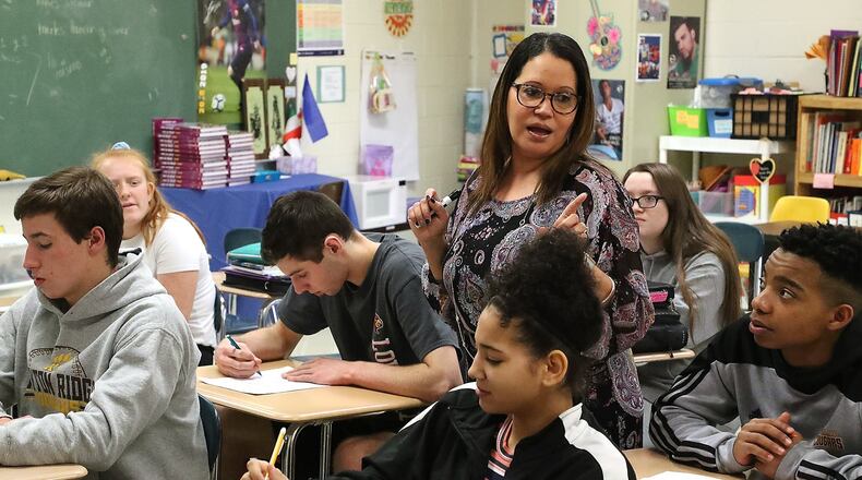 Viangie Sanchez Gibson, Spanish teacher at Kenton Ridge High School in the Northeastern Local School District, is one of four teachers chosen to receive the Excellence in Teaching Award at the Springfield Rotary Club meeting on March 16. BILL LACKEY/STAFF
