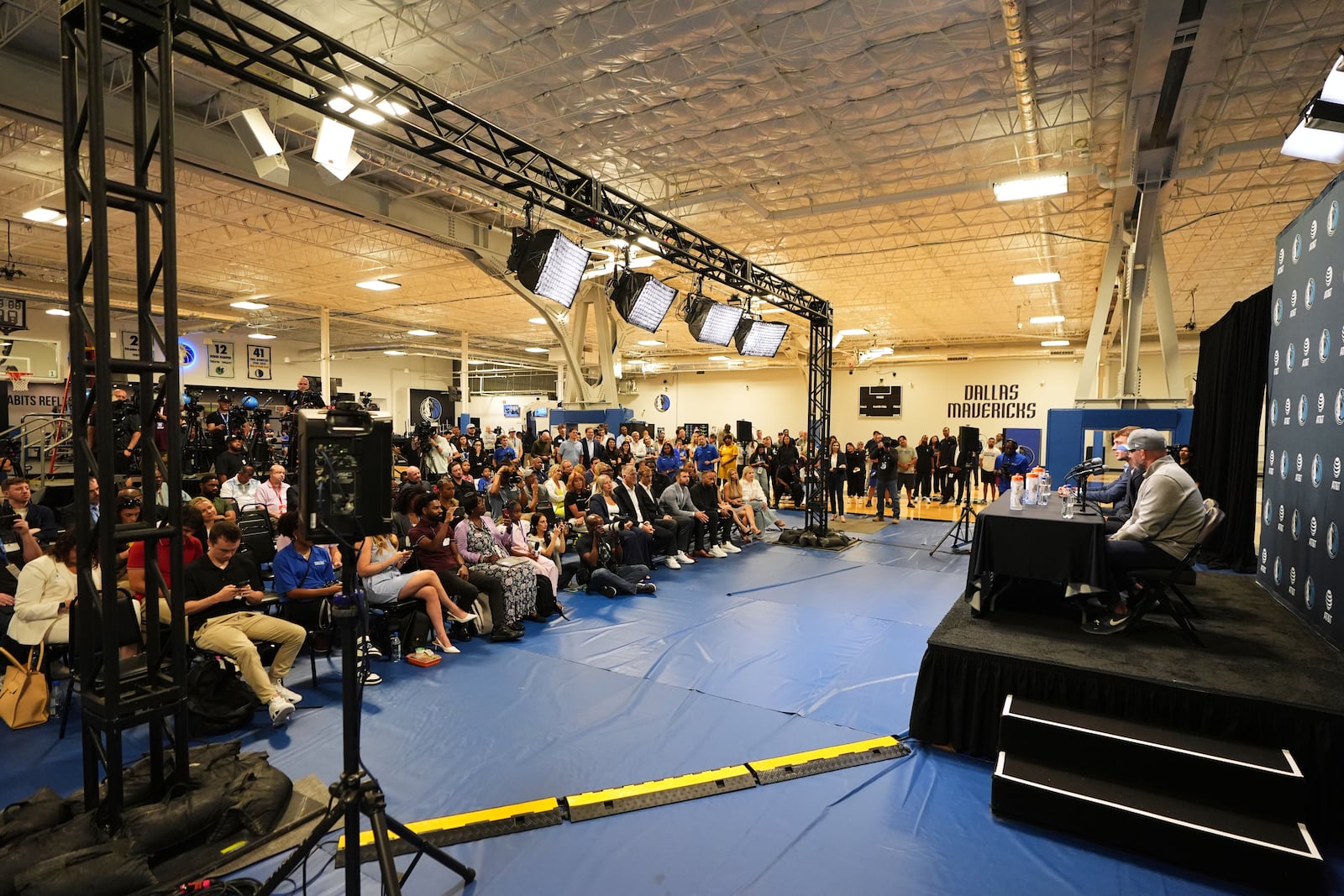 Dallas Mavericks' Cooper Flagg, the No. 1 overall pick in the NBA draft, at podium with head coach Jason Kidd, right, responds to questions during an NBA basketball press conference at the team's practice facility, Friday, June 27, 2025, in Dallas. (AP Photo/Tony Gutierrez)