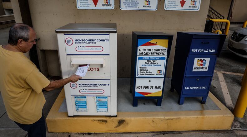 Sean Caldwell drops his ballot off at Montgomery County Board of Elections at the drop box last November. Jim Noelker/Staff