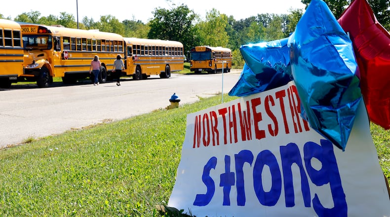 The Fellowship Christian Church was surrounded by 37 school buses Monday, August 28, 2023 during the funeral for 11-year-old Aiden Clark, who was killed in a fatal Northwestern school bus crash last week. BILL LACKEY/STAFF