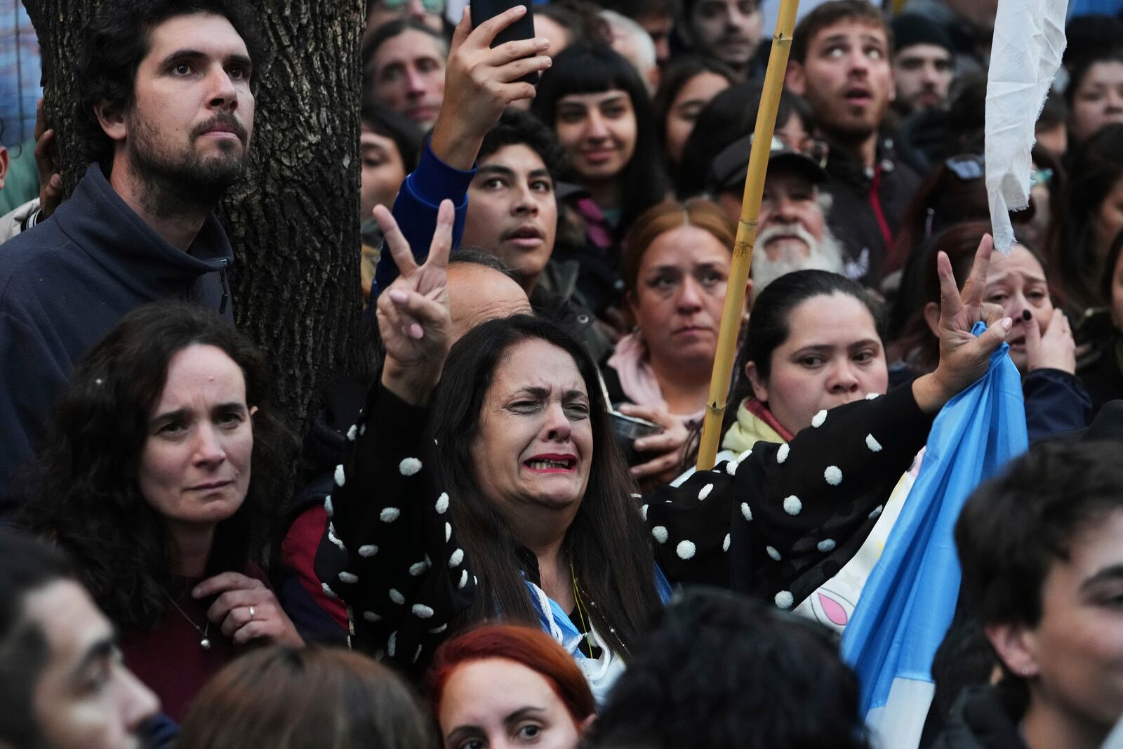 Supporters of former President Cristina Fernandez react after Argentina's Supreme Court upheld her corruption conviction, outside the Peronist Party headquarters in Buenos Aires, Argentina, Tuesday, June 10, 2025. (AP Photo/Rodrigo Abd)