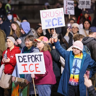Demonstrators listen to a speaker during the Dayton to Minneapolis Stop ICE Terror protest in Courthouse Square in Dayton on Thursday, Jan. 8. The protest was organized by a local chapter of the Party for Socialism and Liberation. BRYANT BILLING/STAFF