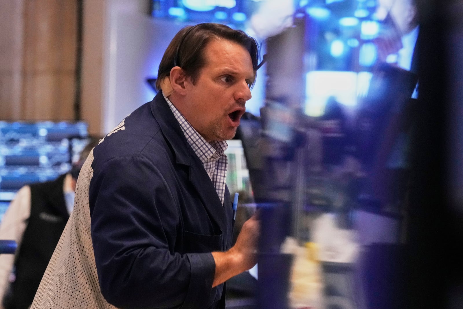 Trader Michael Milano works on the floor of the New York Stock Exchange, Thursday, May 1, 2025. (AP Photo/Richard Drew)