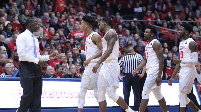Dayton’s Anthony Grant huddles with his team during a game against Davidson on Tuesday, Jan. 23, 2018, at UD Arena. David Jablonski/Staff