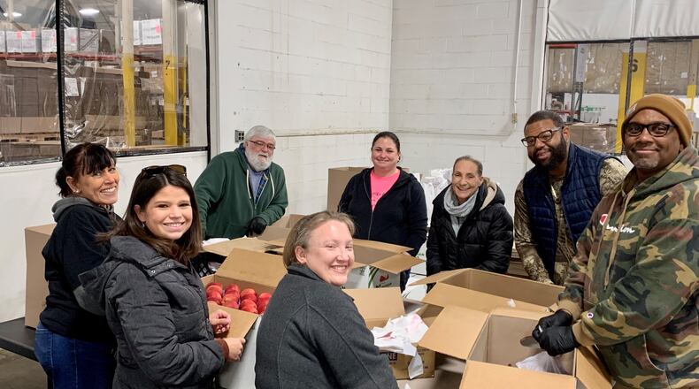 Oesterlen Services For Youth's executive team volunteered at the Second Harvest Food Bank. Contributed