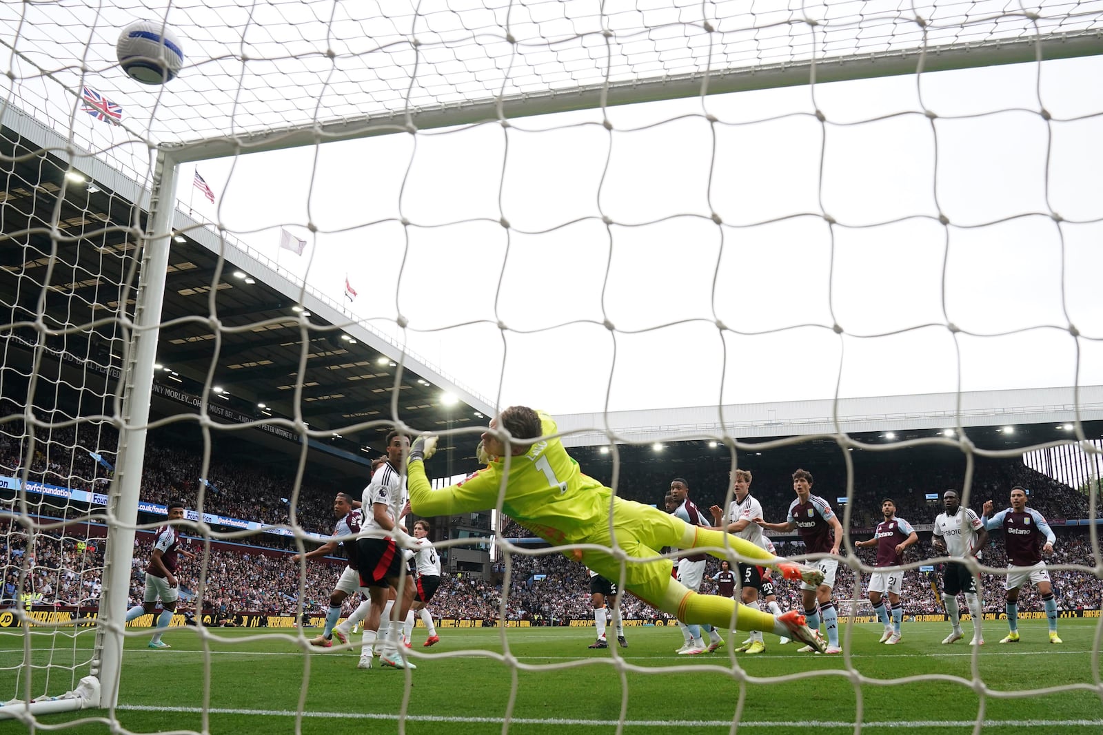 Aston Villa's Youri Tielemans, second from left, scores the opening goal during the English Premier League soccer match between Aston Villa and Fulham at Villa Park, Birmingham, England, Saturday, May 3, 2025. (Nick Potts/PA via AP)