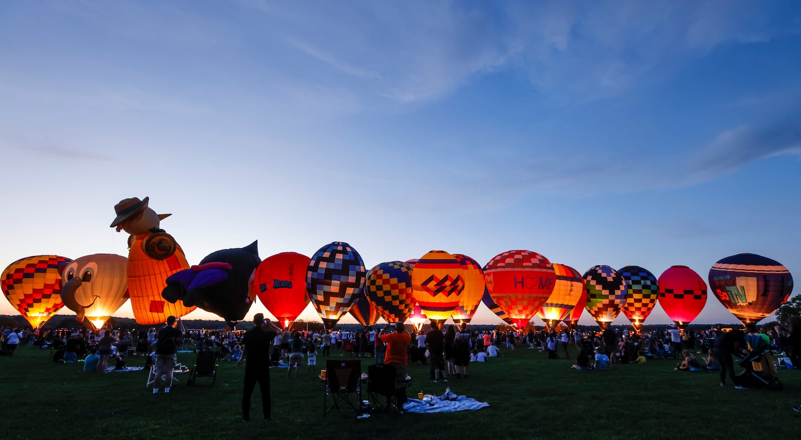 The Ohio Challenge Hot Air Balloon and Skydiving Festival kicked off the weekend event Friday, July 19, 2024 at Smith Park in Middletown with balloon launch and glow, flag and pyrotechnics jumps by Team Fastrax, fireworks show by Yokum Fireworks, a drone show and more. NICK GRAHAM/STAFF