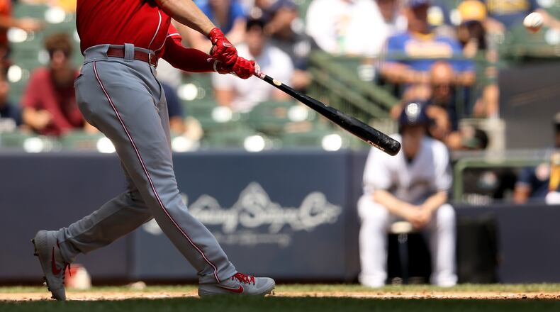 MILWAUKEE, WISCONSIN - JULY 24:  Josh VanMeter #17 of the Cincinnati Reds hits a home run in the third inning against the Milwaukee Brewers at Miller Park on July 24, 2019 in Milwaukee, Wisconsin. (Photo by Dylan Buell/Getty Images)
