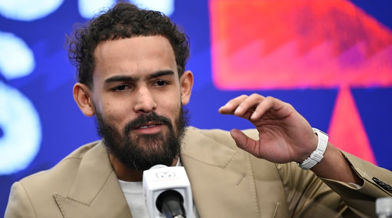 Washington Wizards newly acquired point guard Trae Young answers a question at news conference before an NBA basketball game against the New Orleans Pelicans, Friday, Jan. 9, 2026, in Washington. (AP Photo/John McDonnell)