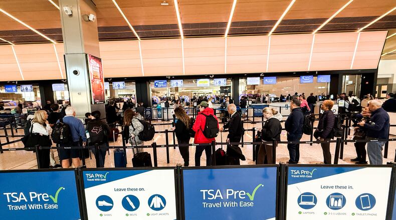 People wait in a TSA security line at Terminal A of Newark Liberty International Airport (EWR) in Newark, N.J., U.S., Tuesday, March 24, 2026. (AP Photo/Eduardo Munoz Alvarez)