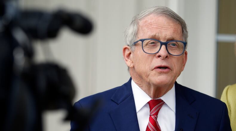 Ohio Gov. Mike DeWine talks with reporters outside of his polling place after voting in Cedarville, Ohio, Tuesday, May 3, 2022. (AP Photo/Paul Vernon)