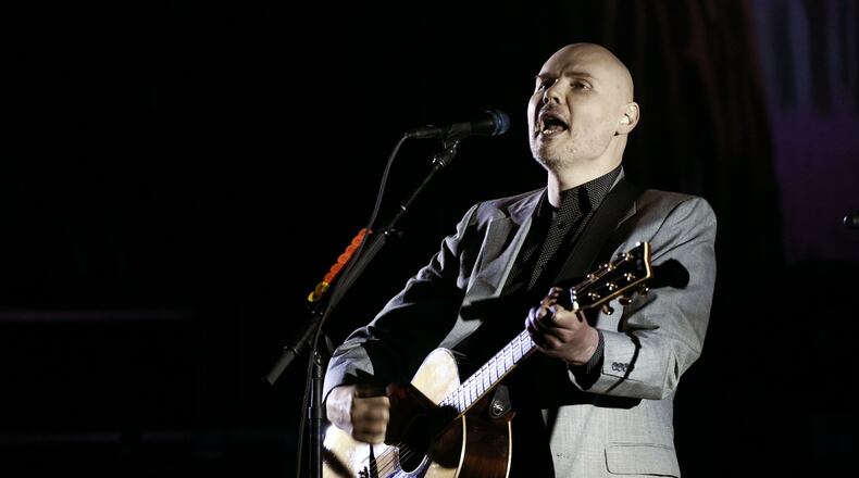 In this Saturday, March 26, 2017 file photo, Billy Corgan of the Smashing Pumpkins performs at The Theatre at Ace Hotel in Los Angeles. The Smashing Pumpkins will return to the stage this summer with their first tour in nearly 20 years to feature founding members Billy Corgan, Jimmy Chamberlin and James Iha. The tour includes stops in Columbus and Indianapolis. (Photo by Chris Pizzello/Invision/AP, File)