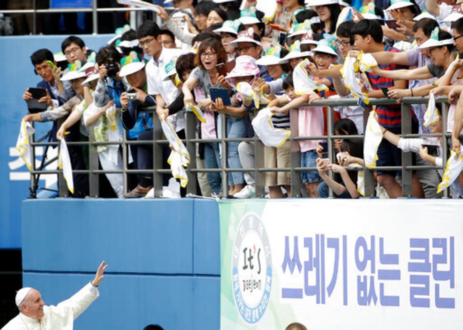 FILE - Pope Francis blesses faithfuls as he arrives to celebrate the Mass of Assumption of Mary at Daejeon World Cup stadium in Daejeon, South Korea, Friday, Aug. 15, 2014. (AP Photo/Gregorio Borgia, file)