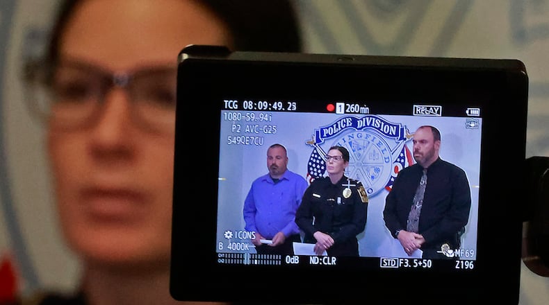 Springfield Police Chief Allison Elliott along with Lt. Jeff Williams, left, and Sgt. James Byron are seen through a video camera as they give a press conference Friday, Jan. 6, 2023. BILL LACKEY/STAFF