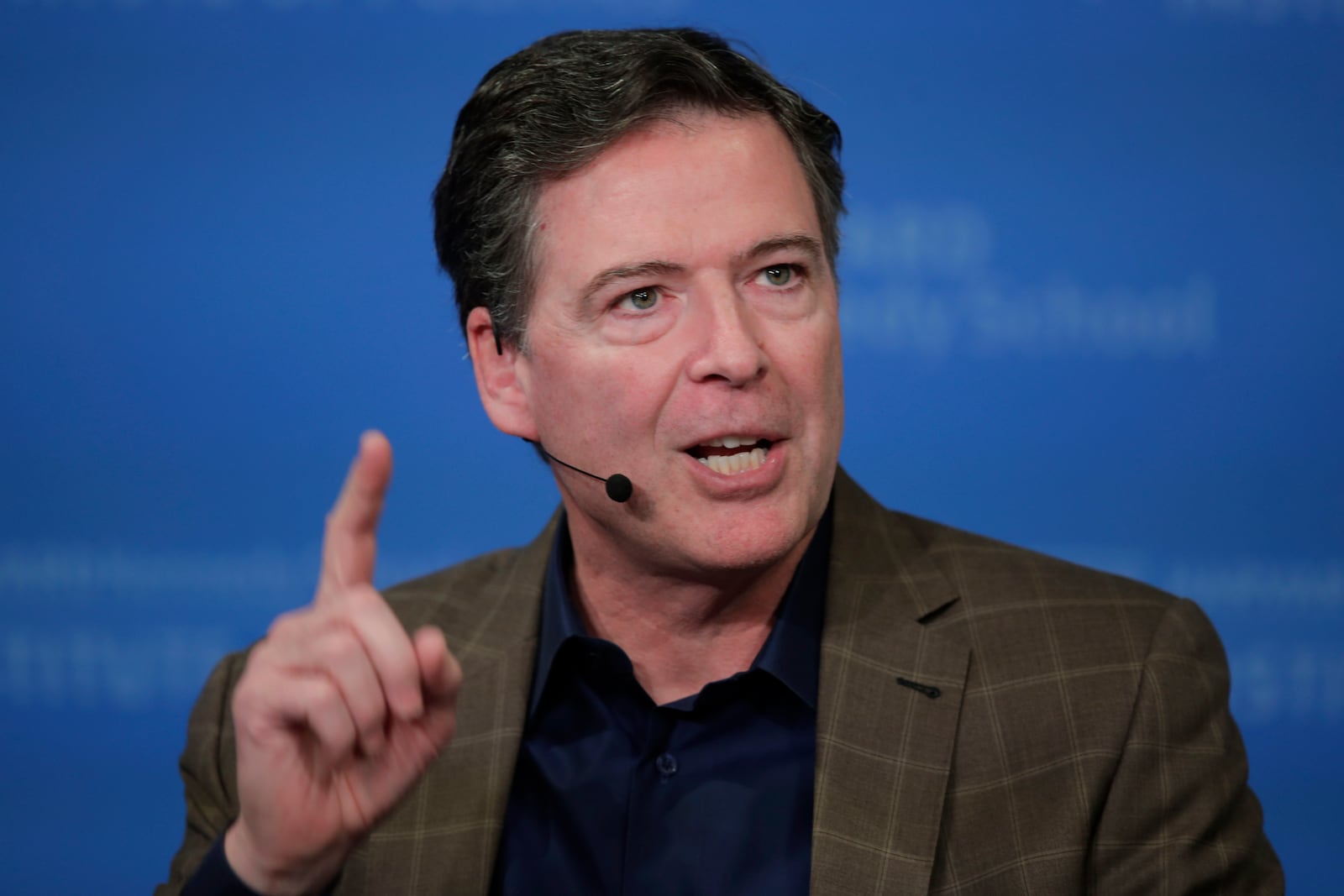 FILE - Former Director of the Federal Bureau of Investigation James Comey speaks at Harvard University's Institute of Politics' JFK Jr. Forum in Cambridge, Mass., Feb. 24, 2020. (AP Photo/Charles Krupa, File)