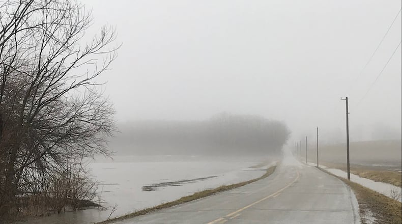 High water along Mitchell Road in Springfield Township Wednesday. ERIC HIGGENBOTHAM/STAFF