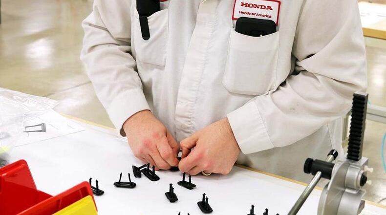 A Honda employee works on compressor components for ventilators in Marysville. CONTRIBUTED