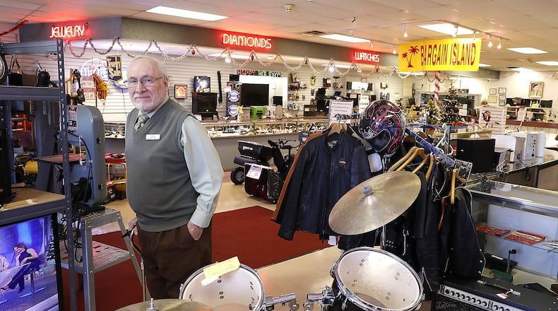 Larry Beloff, owner of Max’s Loan and Jewelers, stands in the showroom among all the different items they sell Thursday. Bill Lackey/Staff