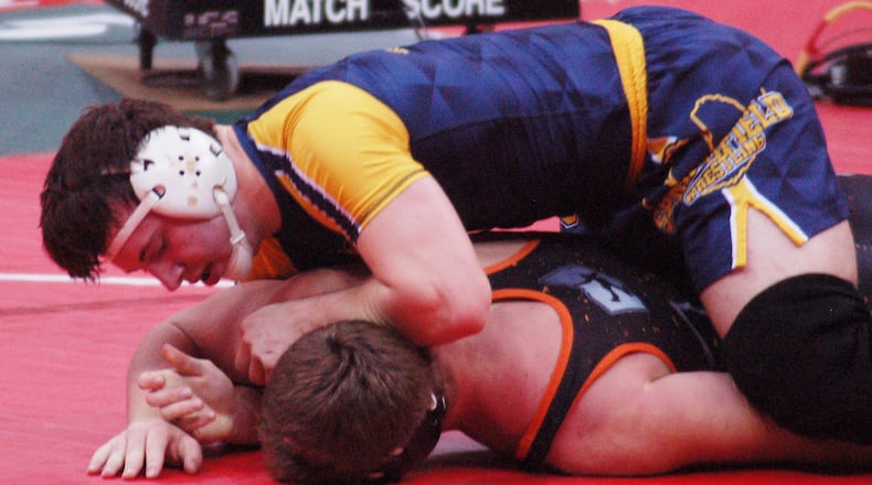 Springfield senior Joe Cochran looks to turn Ashland’s Josh Bever during their D-I 220 consolation semi Saturday morning at the Schottenstein Center. Cochran defeated Bever 12-5 en route to finishing third. JOHN CUMMINGS / CONTRIBUTOR