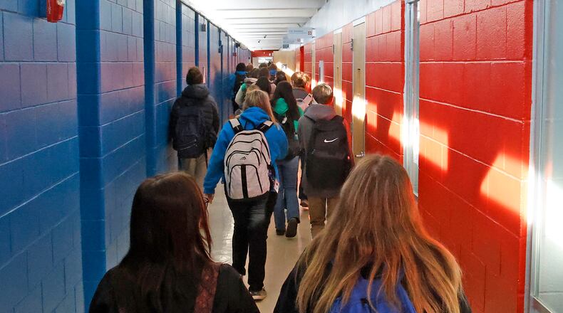 Students walk down a narrow hallway during a class change Tuesday, Feb. 14, 2024 at the Springfield/Clark CTC. BILL LACKEY/STAFF
