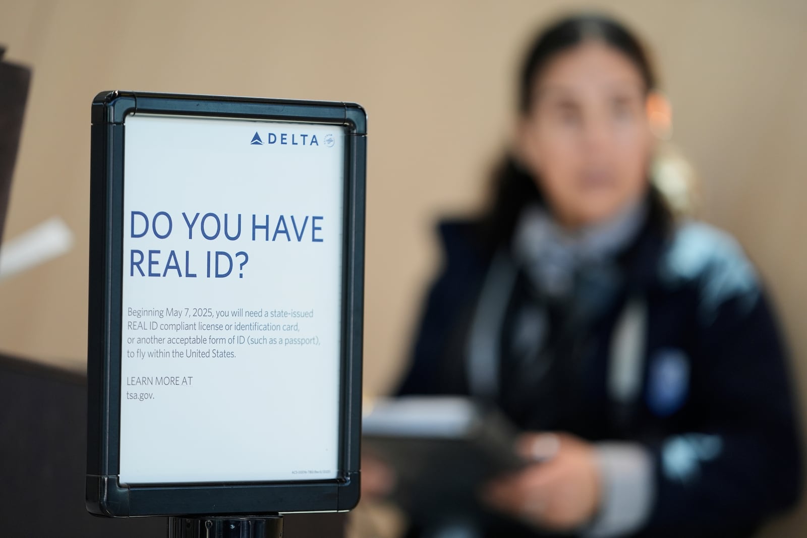 A sign displays information about Real ID at Newark Liberty International Airport in Newark, N.J., Wednesday, May 7, 2025. (AP Photo/Seth Wenig)