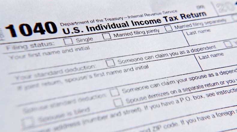 FILE - A 1040 tax form printed from the Internal Revenue Service web page is seen, Feb. 13, 2019, in Zelienople, Pa. (AP Photo/Keith Srakocic, File)