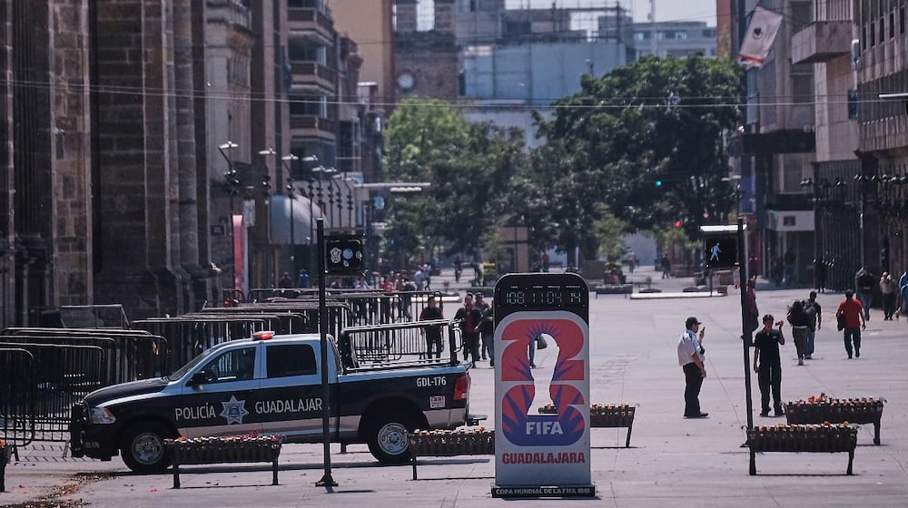 Police officers stand guard in downtown Guadalajara, Jalisco state, Mexico, Sunday, Feb. 22, 2026, after the death of the leader of the Jalisco New Generation Cartel, Nemesio Oseguera Cervantes, known as "El Mencho." (AP Photo/Alejandra Leyva)