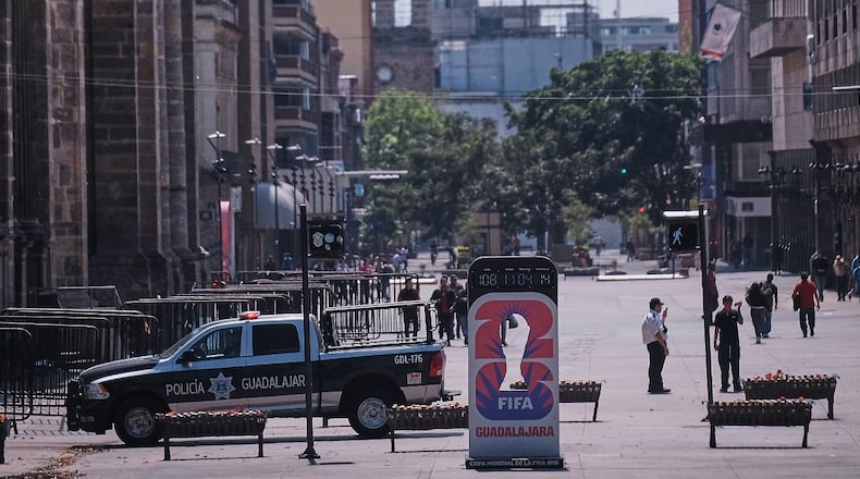 Police officers stand guard in downtown Guadalajara, Jalisco state, Mexico, Sunday, Feb. 22, 2026, after the death of the leader of the Jalisco New Generation Cartel, Nemesio Oseguera Cervantes, known as "El Mencho." (AP Photo/Alejandra Leyva)