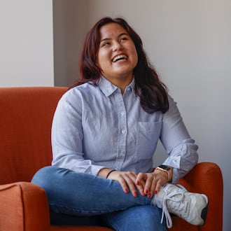 Springfield High School senior Bella Narcelles laughs in a conference room at COhatch Springfield on Thursday, Feb. 19, 2026, while talking about her social evolution in high school. She's launching an Instagram campaign to raise awareness about the local homelessness crisis. JOSEPH COOKE/STAFF