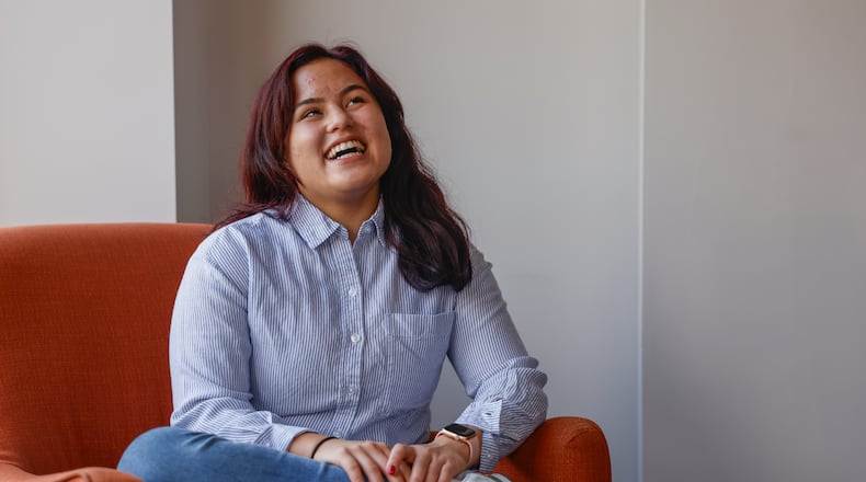 Springfield High School senior Bella Narcelles laughs in a conference room at COhatch Springfield on Thursday, Feb. 19, 2026, while talking about her social evolution in high school. She's launching an Instagram campaign to raise awareness about the local homelessness crisis. JOSEPH COOKE/STAFF