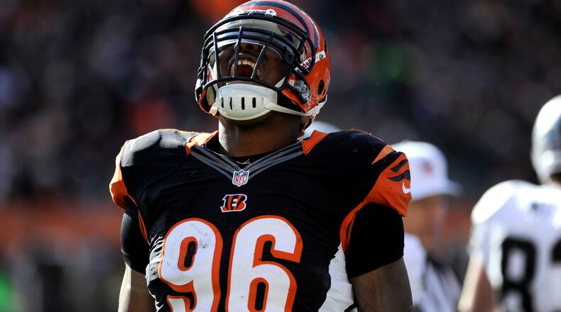 Cincinnati Bengals defensive end Carlos Dunlap celebrates after tackled an Oakland Raiders player. The Bengals defeated the Oakland Raiders 34-10 during their Sunday, Nov. 25, 2012 game at Paul Brown Stadium. Staff photo by Samantha Grier.