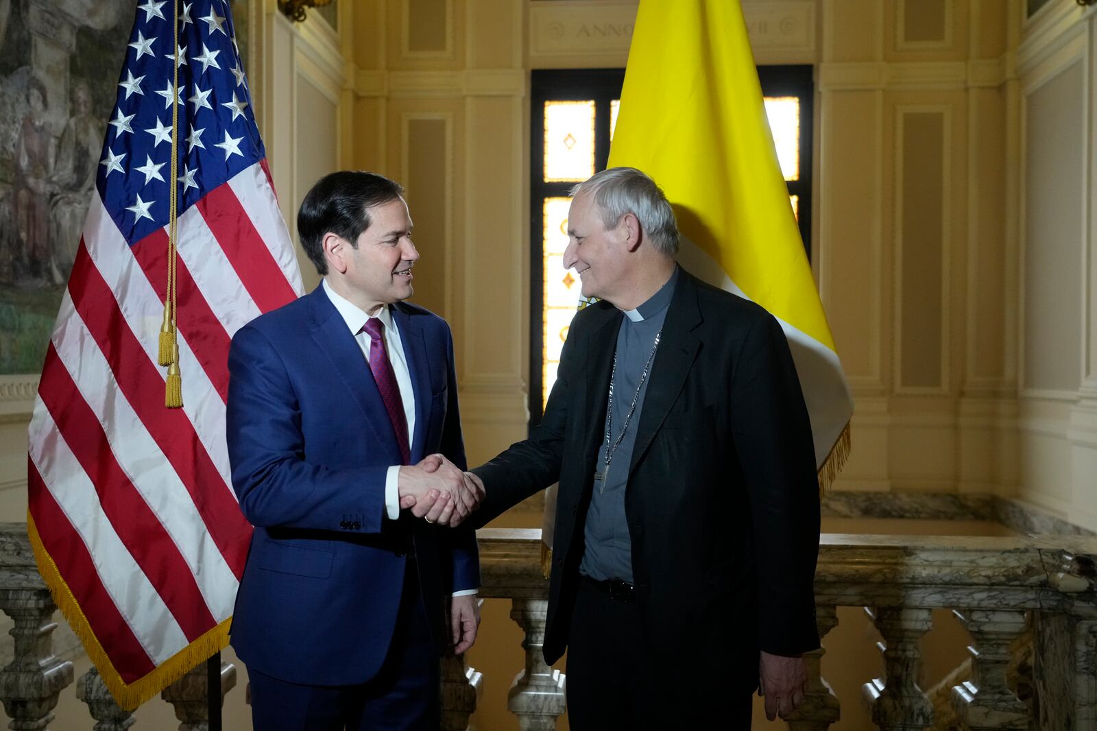 Secretary of State Marco Rubio, left, and President of the Conference of Italian Bishops, Cardinal Matteo Zuppi, pose for a photo at the U.S. Embassy to the Holy See in Rome, Saturday, May 17, 2025. (AP Photo/Gregorio Borgia)