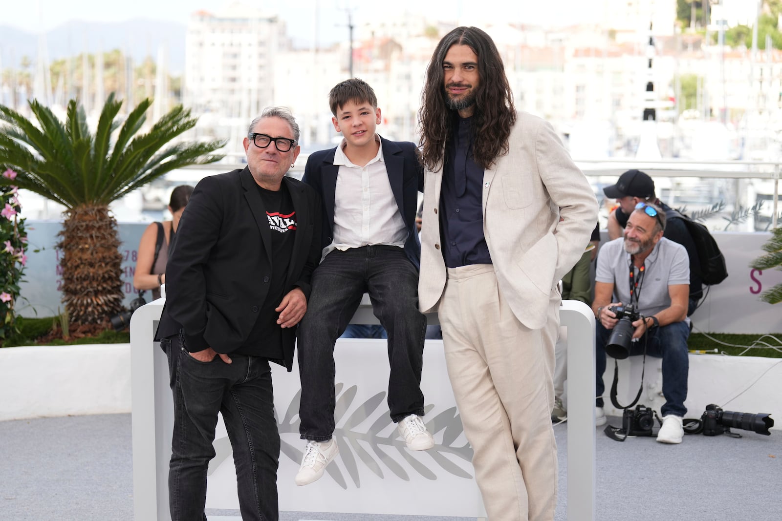 Sergi Lopez, from left, Bruno Nunez, and director Oliver Laxe pose for photographers at the photo call for the film 'Sirat' at the 78th international film festival, Cannes, southern France, Friday, May 16, 2025. (AP Photo/Natacha Pisarenko)