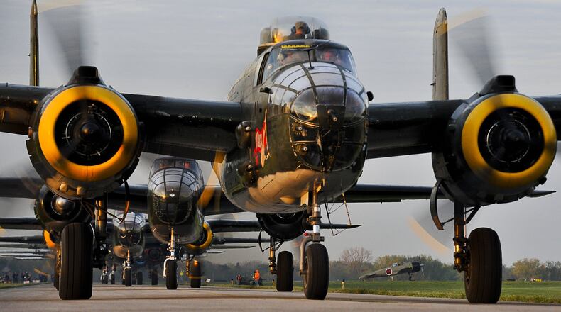 Twenty vintage B-25 bombers line up for take off at Grimes Field in Urbana on April 18, 2012 as they depart for Wright Patterson Air Force Base for the Doolittle Raiders Reunion. It was the largest gathering of the planes since WWII. Staff photo by Bill Lackey