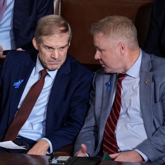 Rep. Jim Jordan, R-Ohio, right, confers with Rep. Warren Davidson, R-Ohio, right, as the House finishes voting on the second day of balloting to elect a speaker, at the Capitol in Washington, Wednesday, Oct. 18, 2023. (AP Photo/J. Scott Applewhite)