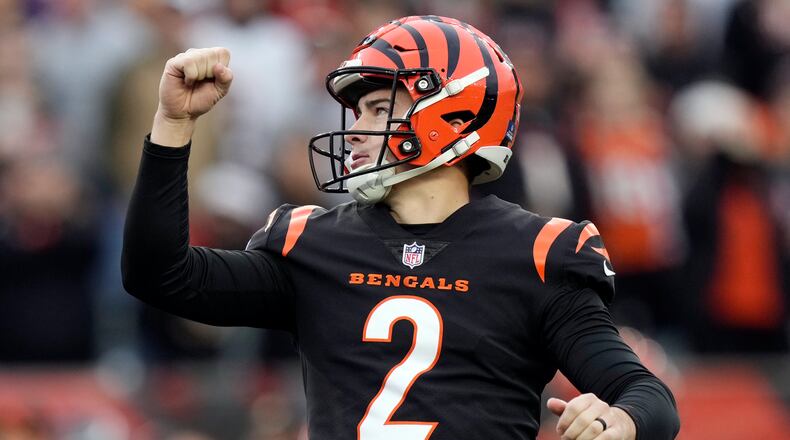 Cincinnati Bengals place kicker Evan McPherson (2) reacts as he kicks the game-winning field goal in overtime of an NFL football game against the Minnesota Vikings Saturday, Dec. 16, 2023, in Cincinnati. (AP Photo/Carolyn Kaster)