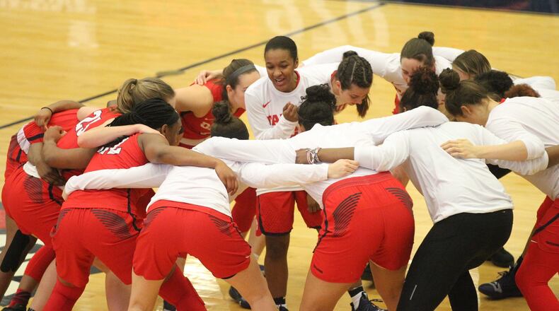 Dayton players huddle before a game against Virginia Commonwealth in the semifinals of the Atlantic 10 Conference tournament on Saturday, March 9, 2019, at the A.J. Palumbo Center in Pittsburgh. David Jablonski/Staff