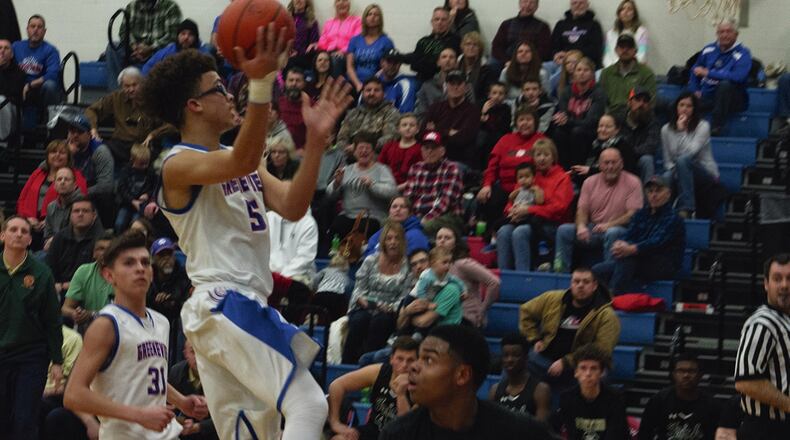 Greeneview’s Cam Treadway glides down the lane for a shot against Catholic Central on Friday in the Rams’ 51-46 victory over the Irish. Jeff Gilbert/CONTRIBUTED
