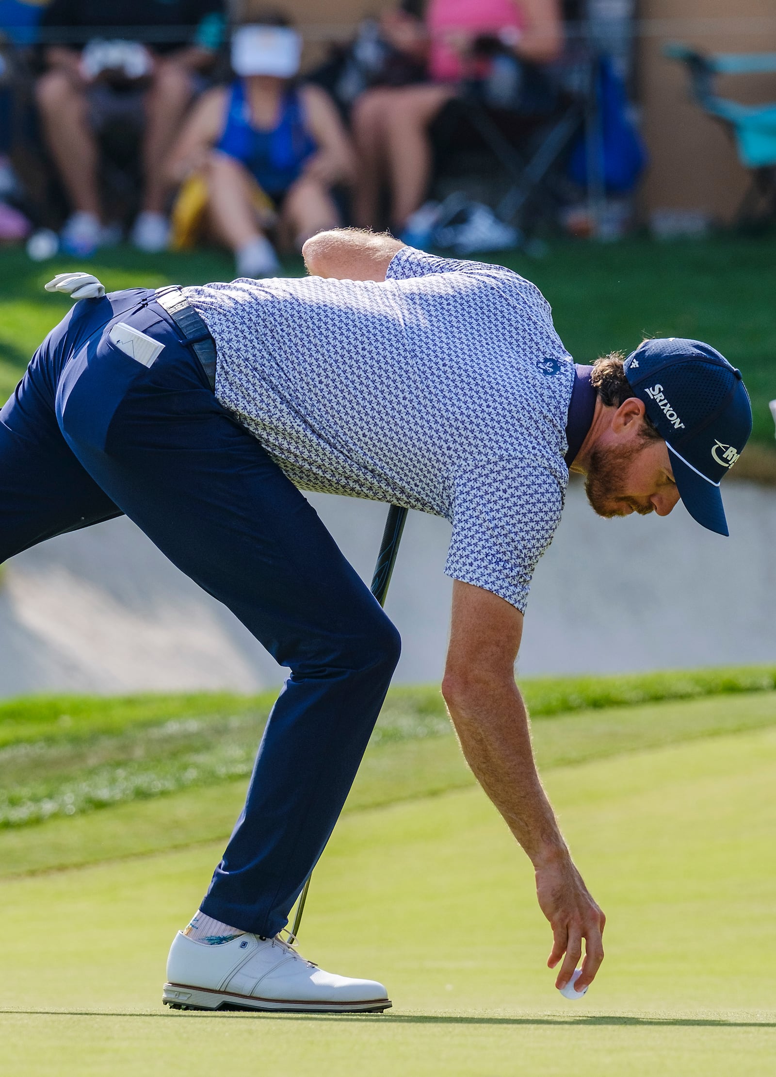 Sam Ryder gets his ball out of the cup after making a birdie on the 16th hole during the first round of the Texas Open golf tournament, Thursday, April 3, 2025, in San Antonio, Texas. (AP Photos/Rodolfo Gonzalez)