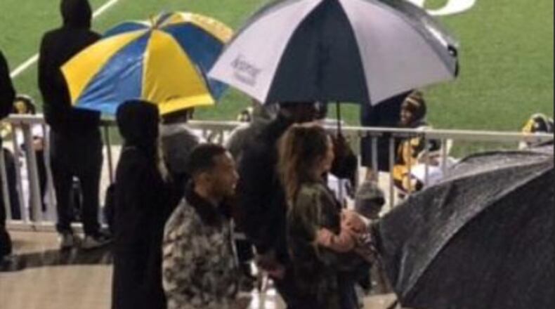 John Legend, Chrissy Teigen, and their daughter attend Springfield, Fairmont football game (iWitness7 photo)